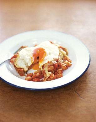 Homemade beans on toast in white bowl