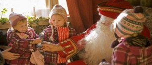 santa with children in grotto
