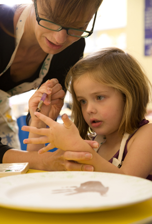 Mum & Daughter painting handprints Mum & Daughter painting handprints