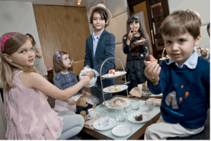 children having afternoon tea