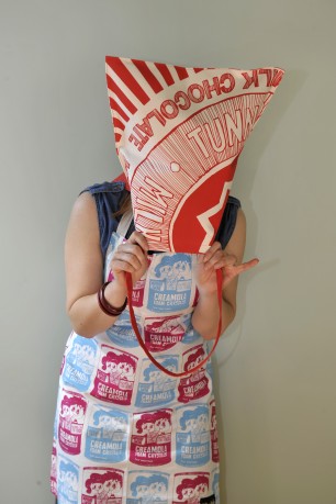 gillian kyle hiding behind bag