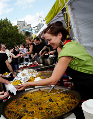 woman serving Spanish Food in London