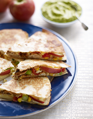 Apple and Chicken quesadillas with sour cream and guacamole 