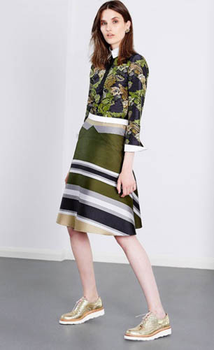 model wears green striped dress