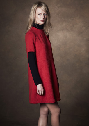 model wears red dress from M&S best of british collciton