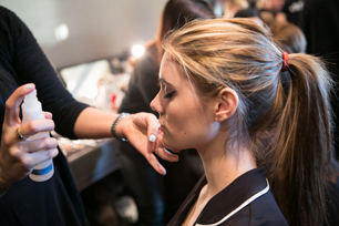 model getting sprayed with skyn ICELAND Mist