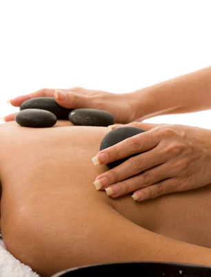 hot stone massage on woman's back
